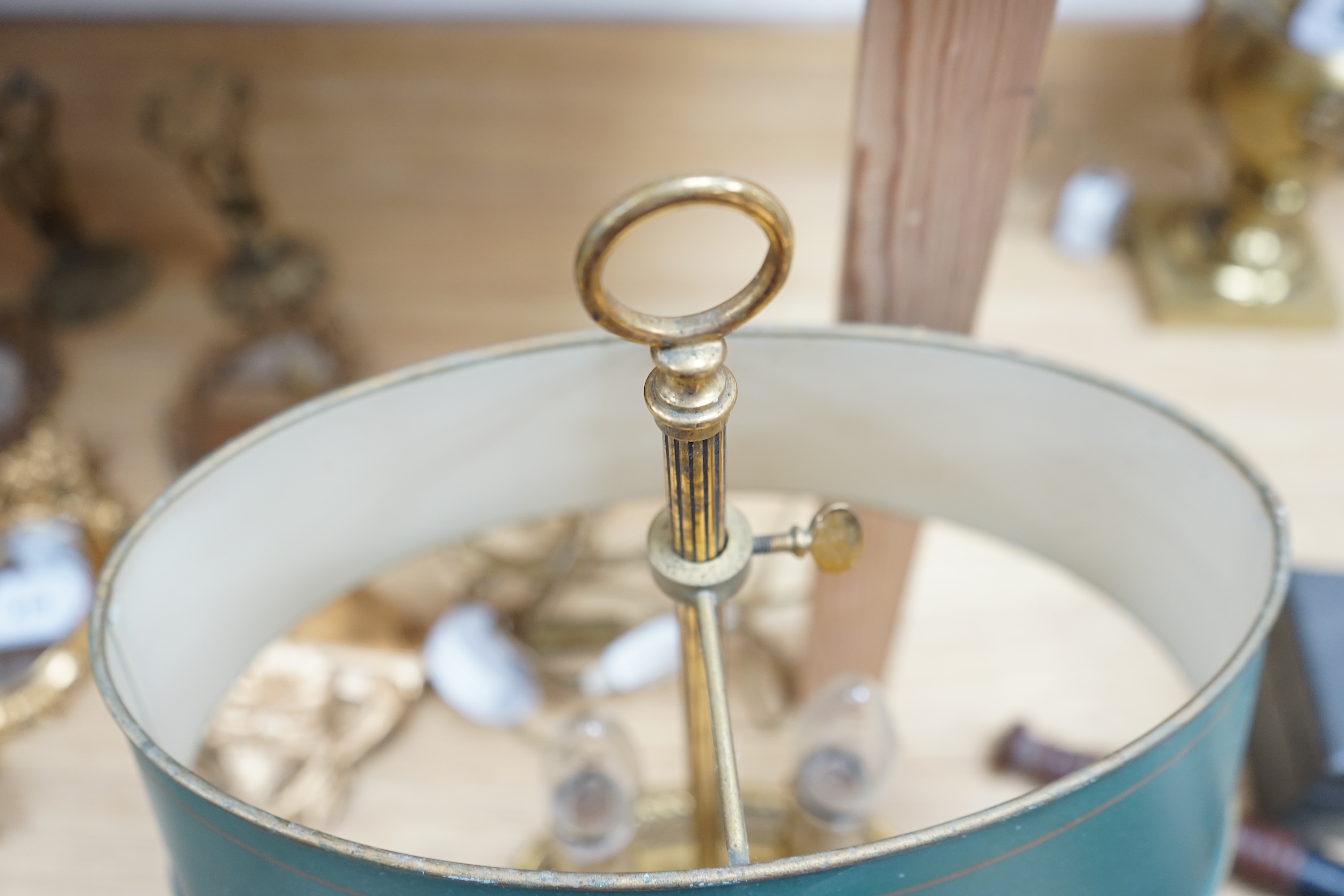 A French two light brass table lamp with toleware shade, 42cm high. Condition - some ware to toleware shade